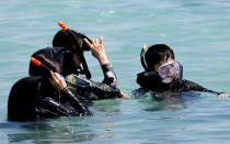<p>Tourists snorkel on the waters off Tumon beach on the island of Guam, a U.S. Pacific Territory, August 11, 2017. (Erik De Castro/Reuters) </p>