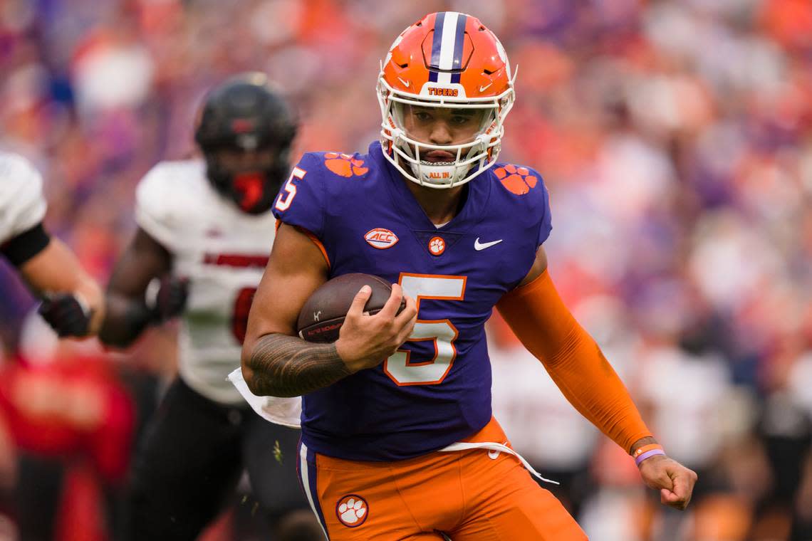 Clemson quarterback DJ Uiagalelei (5) runs with the ball for a touchdown in the first half of an NCAA college football game against Louisville on Saturday, Nov. 12, 2022, in Clemson, S.C. (AP Photo/Jacob Kupferman)