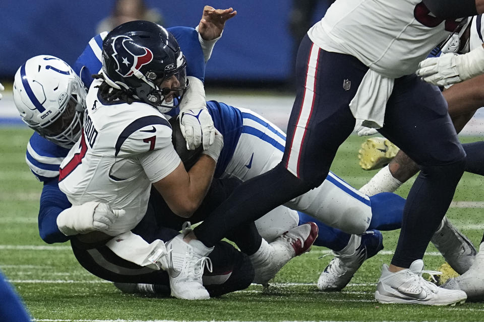 Houston Texans quarterback C.J. Stroud (7) is sacked by Indianapolis Colts defensive tackle DeForest Buckner (99) during the second half of an NFL football game Saturday, Jan. 6, 2024, in Indianapolis. (AP Photo/Darron Cummings)