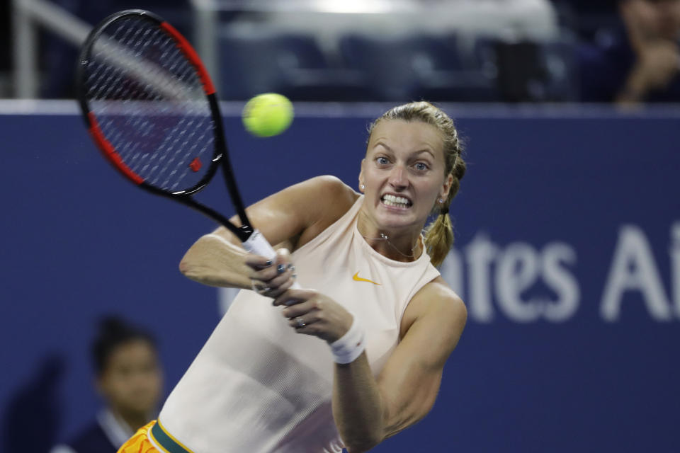 Petra Kvitova, of the Czech Republic, returns a shot against Aryna Sabalenka, of Belarus, in a third-round match at the U.S. Open tennis tournament, Saturday, Sept. 1, 2018, in New York. (AP Photo/Mark Lennihan)