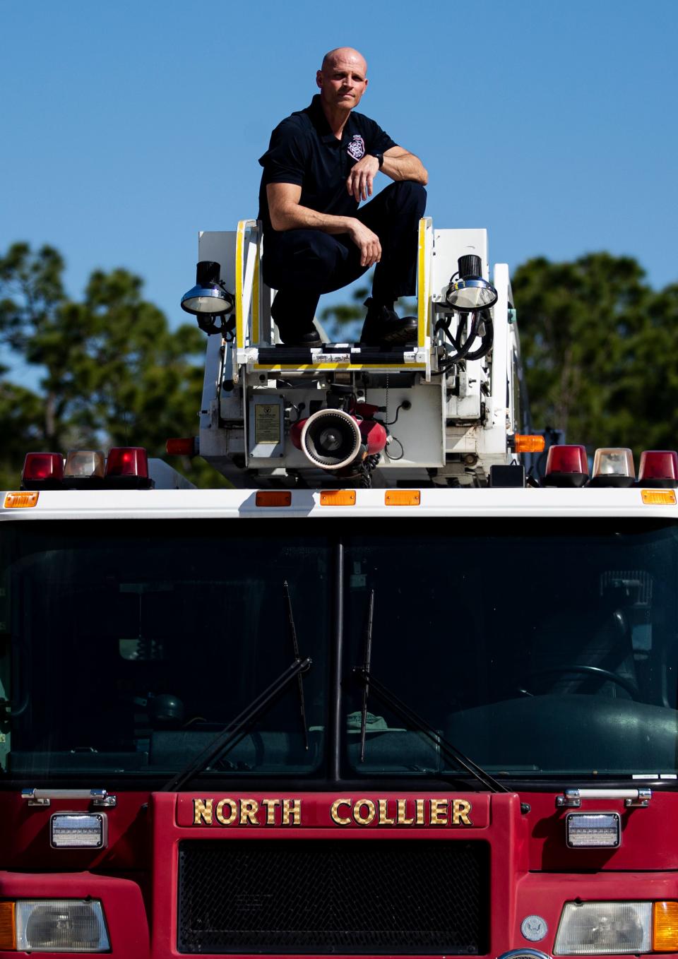 David Perez, an Engineer/Paramedic for the North Collier Fire Department stands for a portrait at the headquarters in Naples on Tuesday, March 12, 2024. Since 2020, Perez has been diagnosed with two forms of cancer, multiple myeloma and mantle cell lymphoma. The diagnoses are on the list cancers that are associated with being a firefighter according a bill that Gov. Ron DeSantis signed into law in 2019. He became in cancer free in Sept. 2023. He attributes his recovery with a healthy mindset, a strict exercise regime, a healthy diet and the use of a sauna along with traditional cancer treatments. He is currently not actively fighting fires, but is educating colleagues on cancer safety.