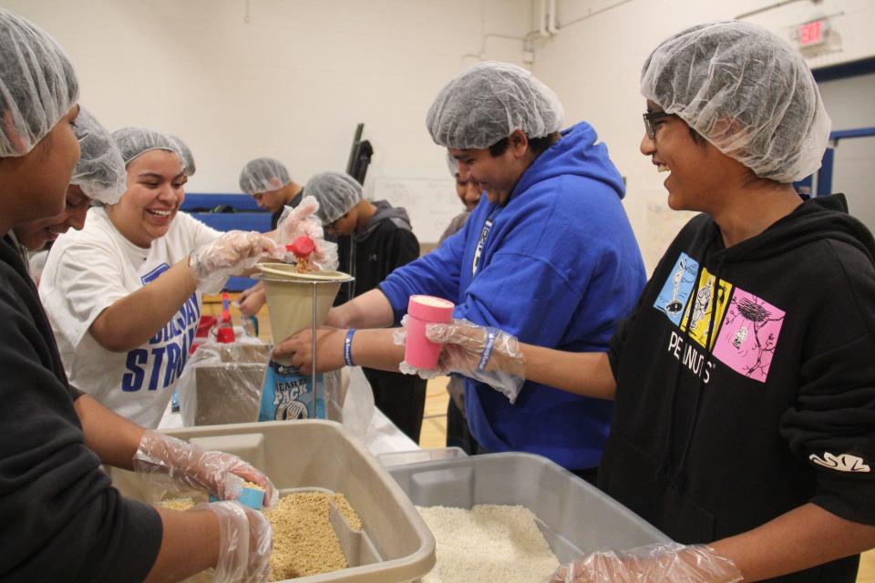 Perry eighth grade students package 20,000 meals during a Meals from the Heartland event on Thursday, May 9, 2024, in the Perry Middle School gym.