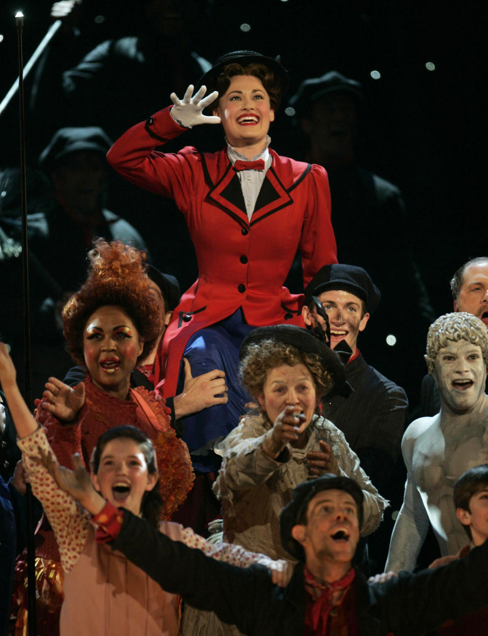 FILE - Rebecca Luker, background, leads a performance of songs from "Mary Poppins" at the 61st Annual Tony Awards in New York on June 10, 2007. Luker, 59, a three-time Tony nominated actor who starred in some of the biggest Broadway hits of the past three decades, died Wednesday, Dec. 23, 2020, said Sarah Fargo, her agent. The actor went public in 2020 saying he had been diagnosed with amyotrophic lateral sclerosis, known as A.L.S. or Lou Gehrig’s disease. (AP Photo/Jeff Christensen, File)