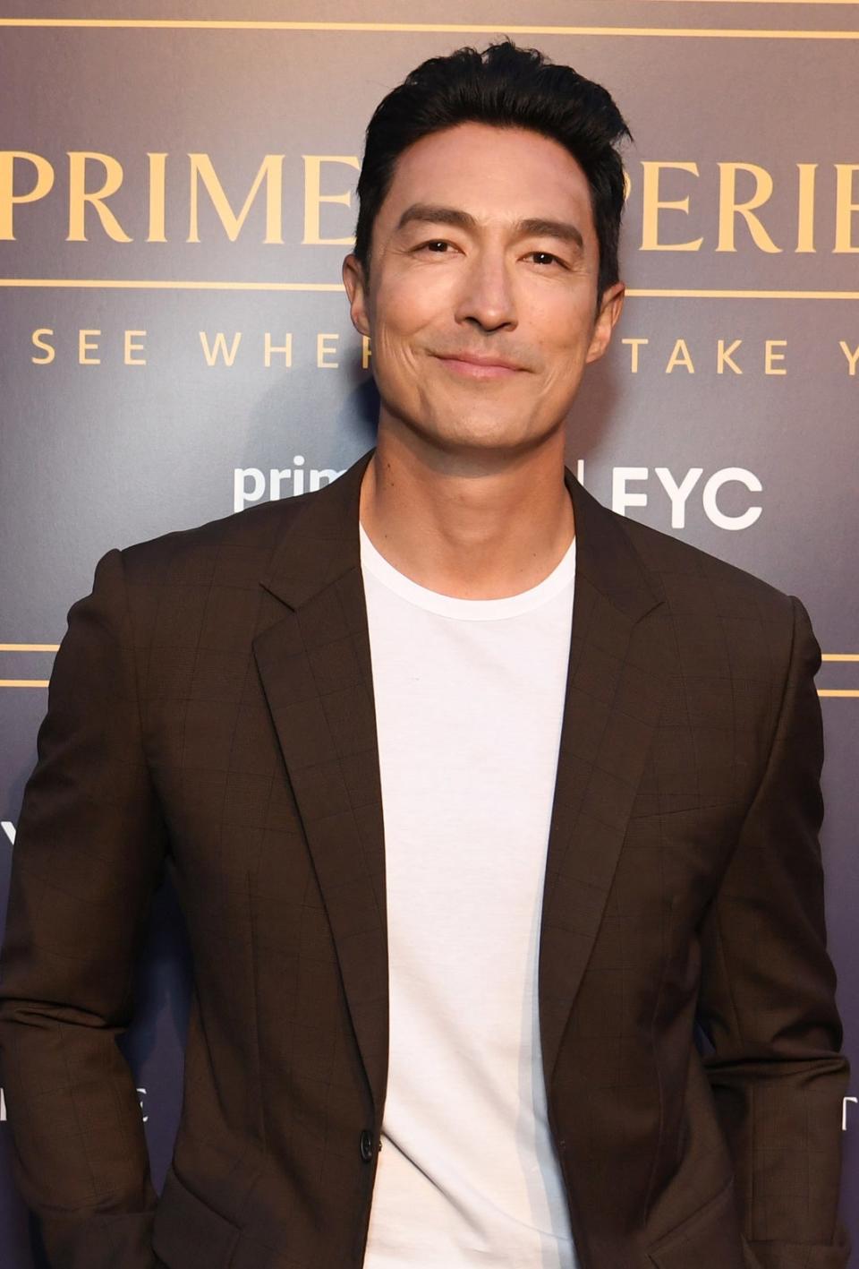 A closeup of Daniel Henney smiling