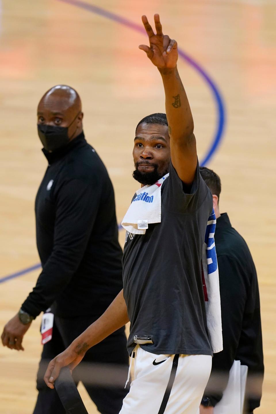 Brooklyn Nets forward Kevin Durant waves after the Nets defeated the Golden State Warriors in an NBA basketball game in San Francisco, Saturday, Feb. 13, 2021. (AP Photo/Jeff Chiu)