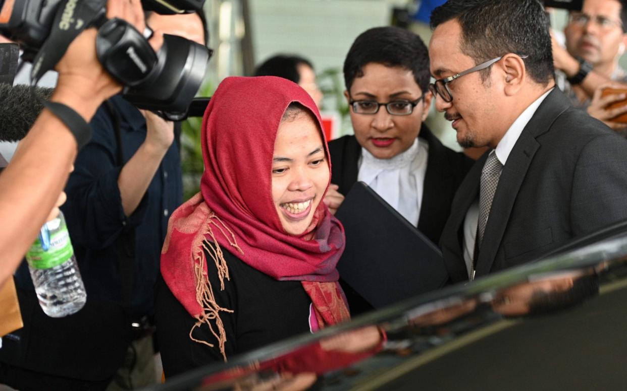 Indonesian national Siti Aisyah (C) smiles while leaving the Shah Alam High Court, outside Kuala Lumpur on Monday  - AFP