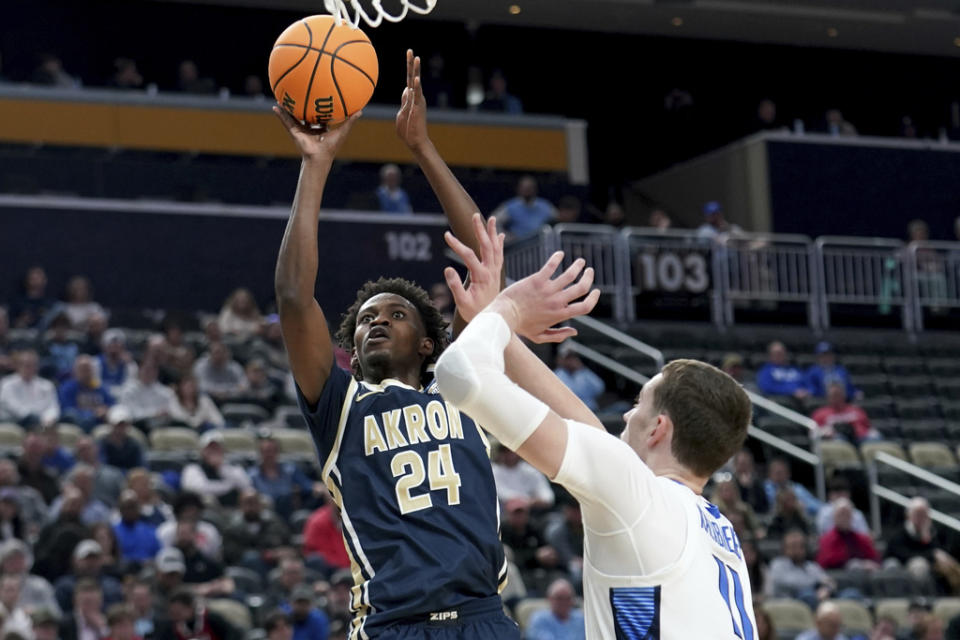 Akron’s Ali Ali shoots over Creighton’s Ryan Kalkbrenner during the first half of a college basketball game in the first round of the NCAA men’s tournament Thursday, March 21, 2024, in Pittsburgh. (AP Photo/Matt Freed)
