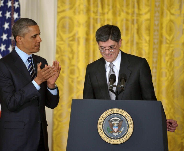 US President Barack Obama applauds after he announced his choice of White House Chief of Staff Jack Lew (R) as the next Treasury Secretary in the East Room of the White House on January 10, 2013 in Washington, DC. Lew, 57, is a classic Washington insider, with multiple tours of duty across the government, including two as budget director