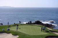 Feb 10, 2018; Pebble Beach, CA, USA; Dustin Johnson putts on the seventh green during the third round of the AT&T Pebble Beach Pro-Am golf tournament at Pebble Beach Golf Links. Mandatory Credit: Orlando Ramirez-USA TODAY Sports