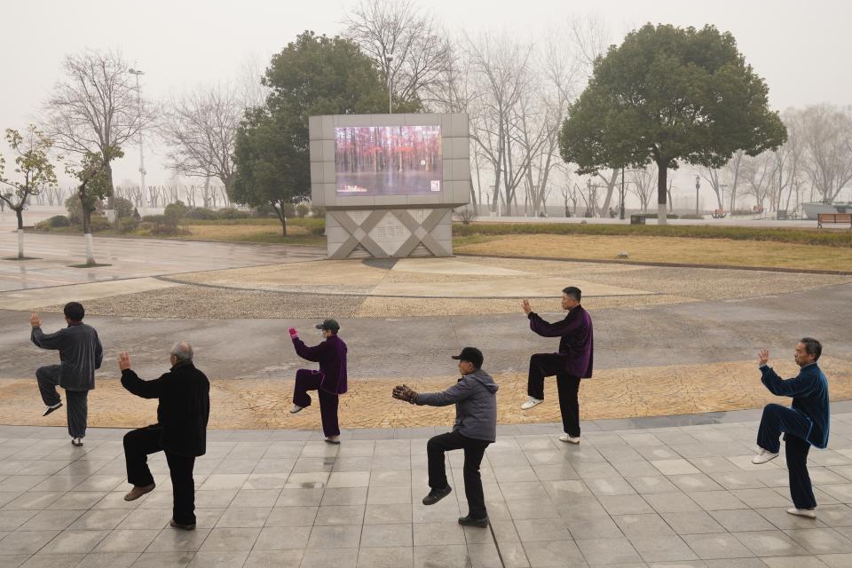 Residents practice tai chi at a park in Wuhan in central China's Hubei Province on Saturday, Jan. 23, 2021. A year after it was locked down to contain the spread of coronavirus, the central Chinese city of Wuhan has largely returned to normal, even as China continues to battle outbreaks elsewhere in the country. (AP Photo/Ng Han Guan)