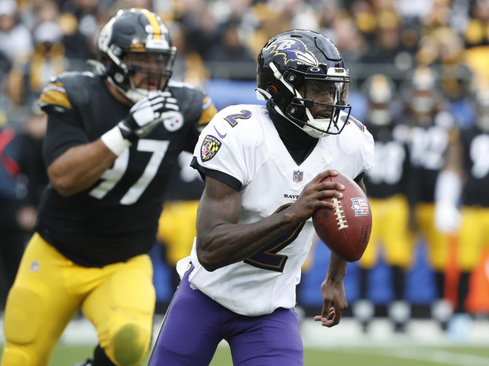 Dec 11, 2022; Pittsburgh, Pennsylvania, USA; Baltimore Ravens quarterback Tyler Huntley (2) scrambles with the ball against the Pittsburgh Steelers during the first quarter at Acrisure Stadium. Mandatory Credit: Charles LeClaire-USA TODAY Sports