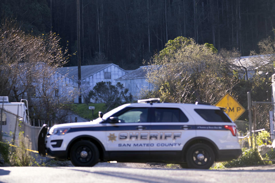 Law enforcement personnel work at the scene of shooting at Mountain Mushroom Farm, Tuesday, Jan. 24, 2023, after a gunman killed several people at two agricultural businesses in Half Moon Bay, Calif. Officers arrested a suspect in Monday’s shootings, 67-year-old Chunli Zhao, after they found him in his car in the parking lot of a sheriff’s substation, San Mateo County Sheriff Christina Corpus said. (AP Photo/Aaron Kehoe)