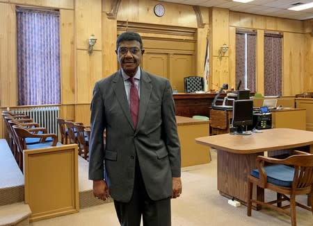 Judge Booker T. Stephens poses in his courtroom in Welch