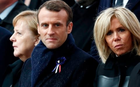 (From L) German Chancellor Angela Merkel, French President Emmanuel Macron and his wife Brigitte Macron attend a ceremony at the Arc de Triomphe in Paris on November 11, 2018  - Credit:  BENOIT TESSIER/AFP
