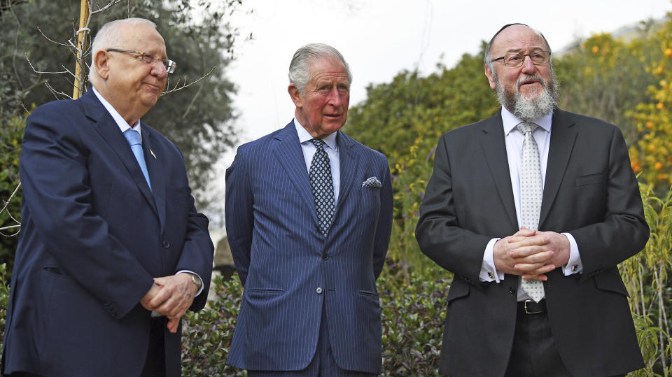 Britain's Prince Charles, center, meets with Israel President Reuven Rivlin, left, and Chief Rabbi Ephraim Mirvis at his official residence in Jerusalem, Thursday Jan. 23, 2020. Prince Charles is among dozens of presidents, heads of state and dignitaries who have descended upon the city to attend the largest-ever gathering focused on commemorating the Holocaust and combating modern-day anti-Semitism (Victoria Jones/Pool via AP)