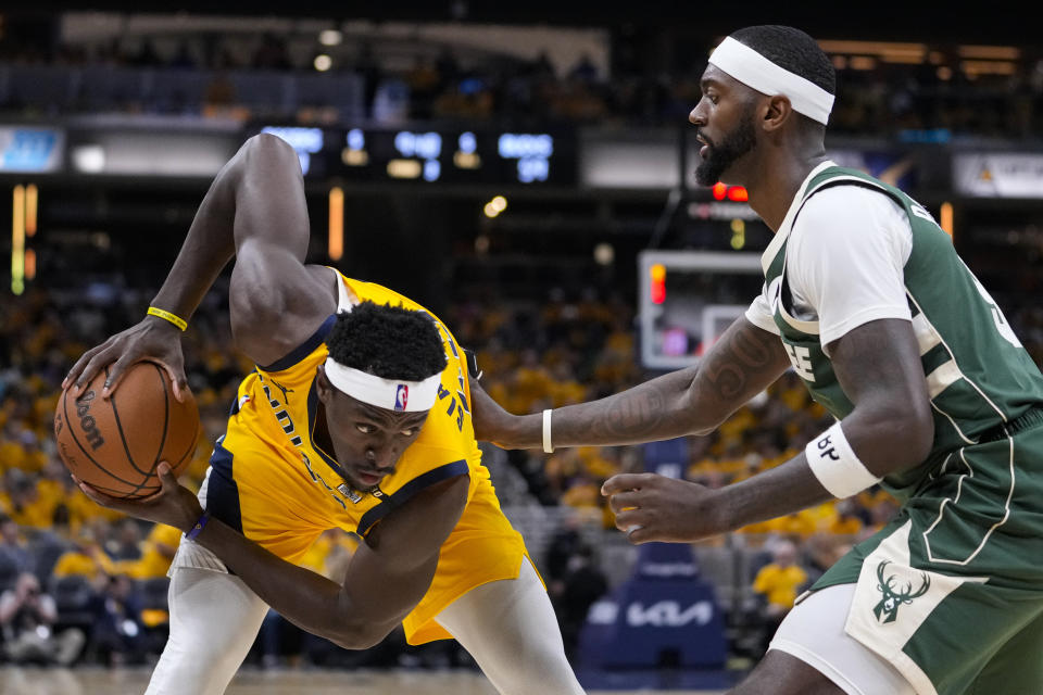 Indiana Pacers forward Pascal Siakam (43) looks to drive on Milwaukee Bucks forward Bobby Portis (9) during the second half in Game 2 in an NBA basketball first-round playoff series, Friday, April 26, 2024, in Indianapolis. (AP Photo/Michael Conroy)