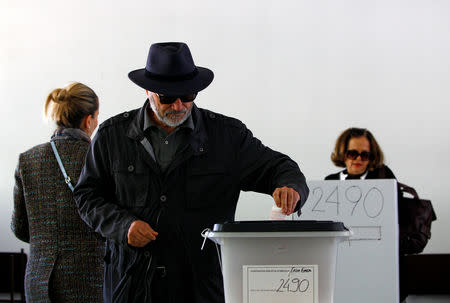 A man casts his ballot for the presidential elections in Skopje, North Macedonia April 21, 2019. REUTERS/Ognen Teofilovski