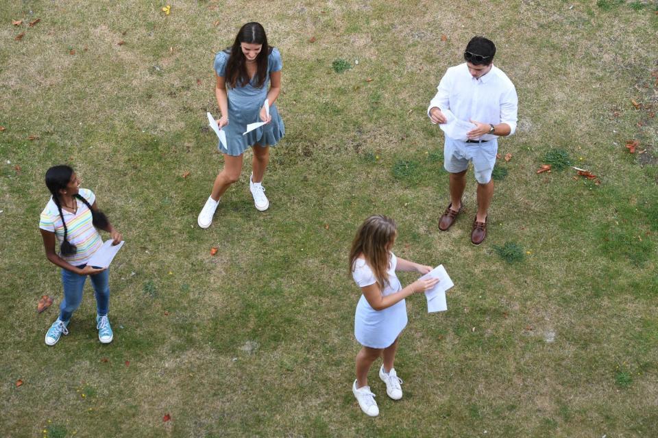 Social distancing was in force as students received their results this morning (PA)