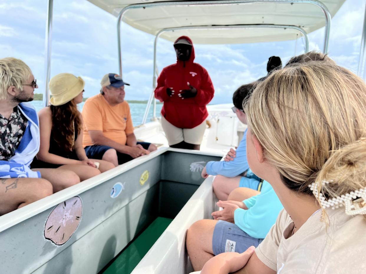 On a glass-bottom boat tour in the Bahamas, we learned about the fish and plants that lived in the lagoon below. (Photo: Terri Peters)