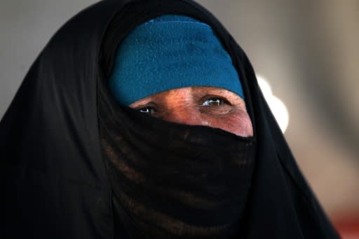 A displaced Iraqi woman looks on in "Camp Seven" near al-Khalidiyeh in Iraq's western Anbar province on April 24, 2018