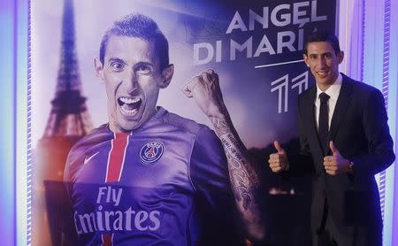 New Paris Saint Germain player, Argentina's Angel Di Maria, poses after a news conference in Paris, France, August 6, 2015. REUTERS/Christian Hartmann