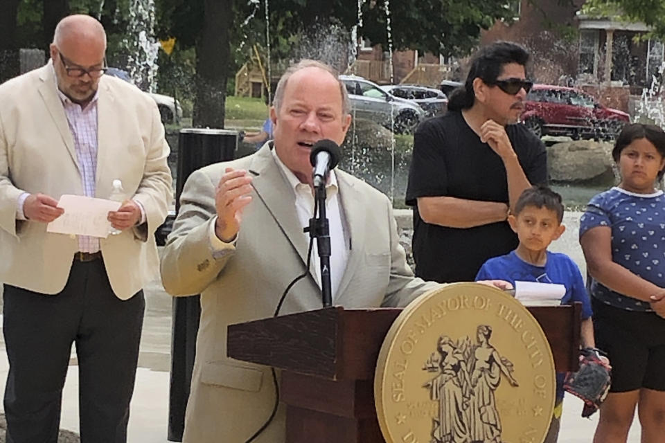 Detroit Mayor Mike Duggan dedicates a splash pad in Clark Park on June 22, 2023, in southwest Detroit. Duggan was elected mayor and took office in 2014. Hoping to slow the exodus of people and businesses from Detroit, its population plummeted from about 1.8 million in 1950 to below 700,000 in 2013, and increase the tax base, Duggan's administration began pushing improvements to city services and quality of life. (AP Photo/Corey Williams)