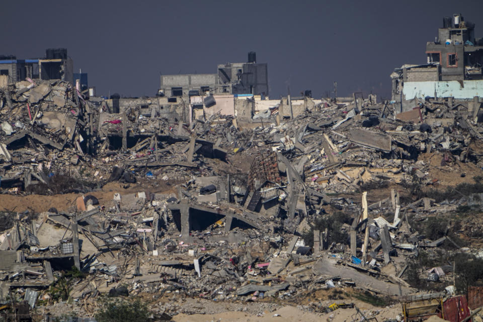 Destroyed buildings in the Gaza Strip, as seen from southern Israel, Friday, Dec. 29, 2023. The army is battling Palestinian militants across Gaza in the war ignited by Hamas' Oct. 7 attack into Israel. (AP Photo/Ariel Schalit)