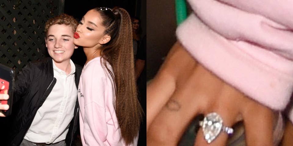 Ariana Grande poses with a fan while displaying her engagement ring on her hand. (Photo: Getty Images)