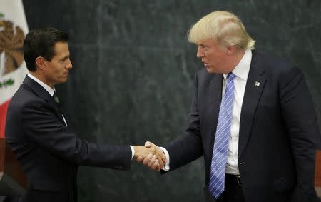 U.S. Republican presidential nominee Donald Trump and Mexico's President Enrique Pena Nieto shake hands at a press conference at the Los Pinos residence in Mexico City, Mexico, August 31, 2016. REUTERS/Henry Romero