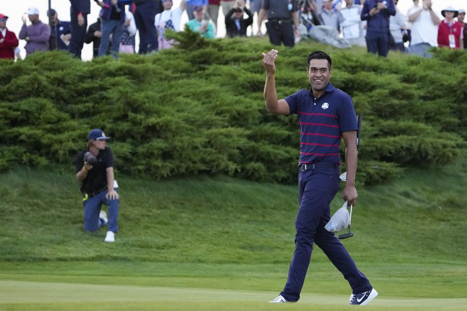 Team USA's Tony Finau reacts after winning a four-ball match the Ryder Cup at the Whistling Straits Golf Course Friday, Sept. 24, 2021, in Sheboygan, Wis. (AP Photo/Jeff Roberson)