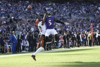 Baltimore Ravens wide receiver Marquise Brown (5) goes up to try to catch a pass as Cincinnati Bengals cornerback Chidobe Awuzie defends during the second half of an NFL football game, Sunday, Oct. 24, 2021, in Baltimore. (AP Photo/Nick Wass)