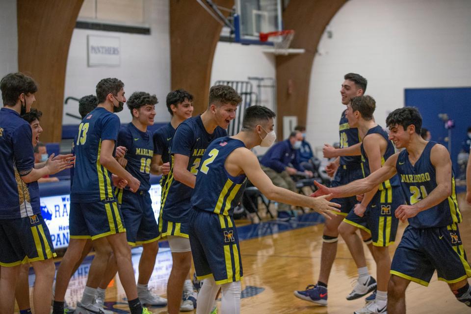 Marlboro celebrates after Marlboro Boys Basketball defeats Ranney School  71-65 in post-season play in Tinton Falls,  NJ on March 3, 2021