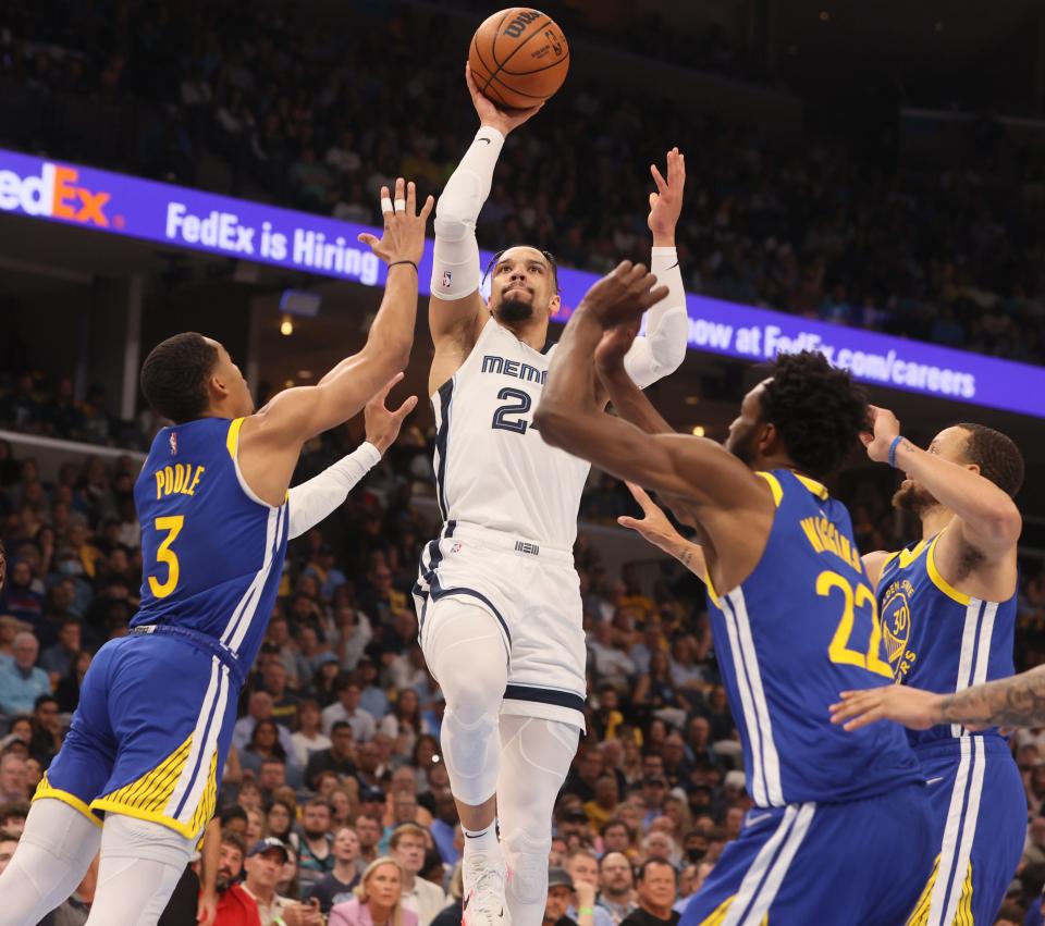 May 1, 2022; Memphis, Tennessee, USA; Memphis Grizzlies guard Dillon Brooks (24) shoots the ball over Golden State Warriors guard Jordan Poole (3) during game one of the second round for the 2022 NBA playoffs at FedExForum. Mandatory Credit: Joe Rondone-USA TODAY Sports