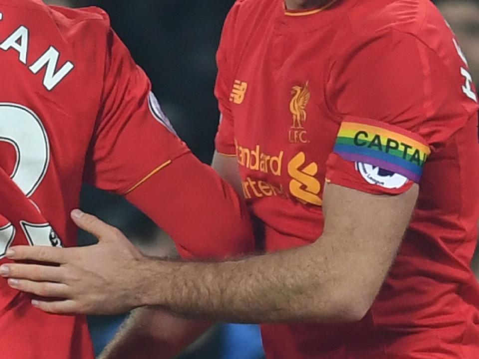 Liverpool midfielder Jordan Henderson wears a rainbow captain's armband in support of LGBT players and fans (Getty)