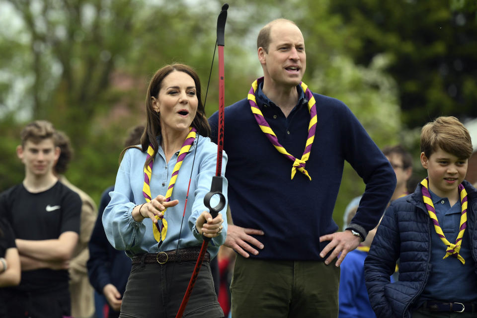 Britain's Kate, Princess of Wales tries her hand at archery while taking part in the Big Help Out, during a visit to the 3rd Upton Scouts Hut in Slough, England, Monday, May 8, 2023. People across Britain were on Monday asked to do their duty as the celebrations for King Charles III's coronation drew to a close with a massive volunteering drive. (Daniel Leal/Pool Photo via AP)