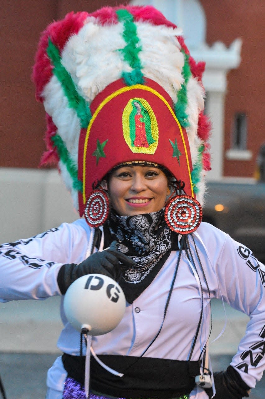 Matachines dancer Bertha Martinez of the Danza Guadalupana dance troupe wears a handmade headdress and carries a handcrafted maraca.