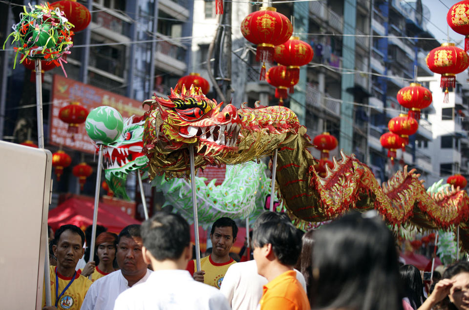 Local Chinese artists perform a dragon dance during celebrations to mark Lunar New Year at Chinatown Saturday, Jan.28, 2017, in Yangon, Myanmar. Saturday marks the Year of the Rooster in the Chinese calendar. (AP Photo/Thein Zaw)