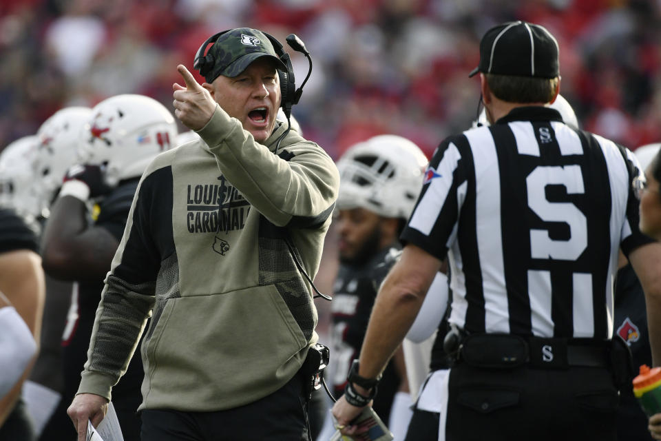 Louisville head coach Jeff Brohm argues with a side judge during the first half of an NCAA college football game in Louisville, Ky., Saturday, Nov. 4, 2023. Louisville won 34-3. (AP Photo/Timothy D. Easley)
