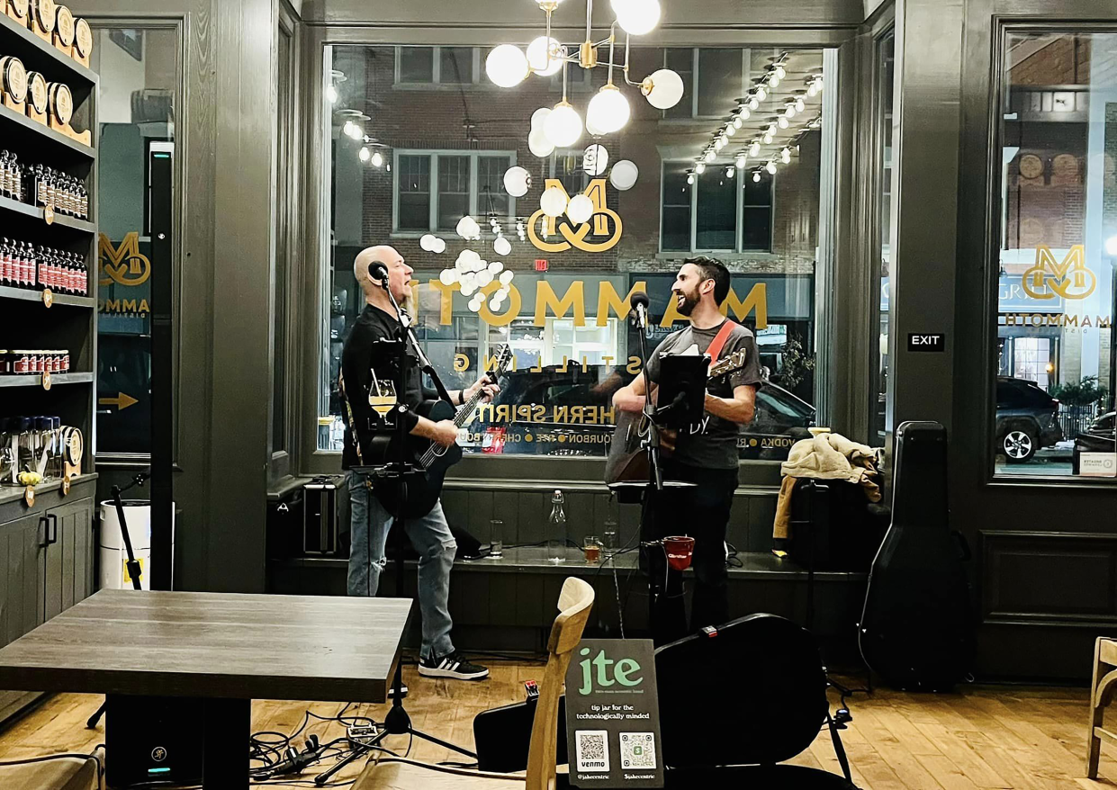 JTE Acoustic Band members Jake Larson, left, and Patrick Bates, right, play a show at Mammoth Distilling in Adrian.   The two-man acoustic cover band plays from 7 to 10 p.m. Thursday, July 27 at the Lenawee County Fair bandshell. Celebrating its 15-year anniversary, the band plays multiple genres of music, from Johnny Cash to George Michael, with a wide variety of songs and styles mixed in during each show. They promise a fun, audience-based show with songs concert goers can sing along and tap their toes to.