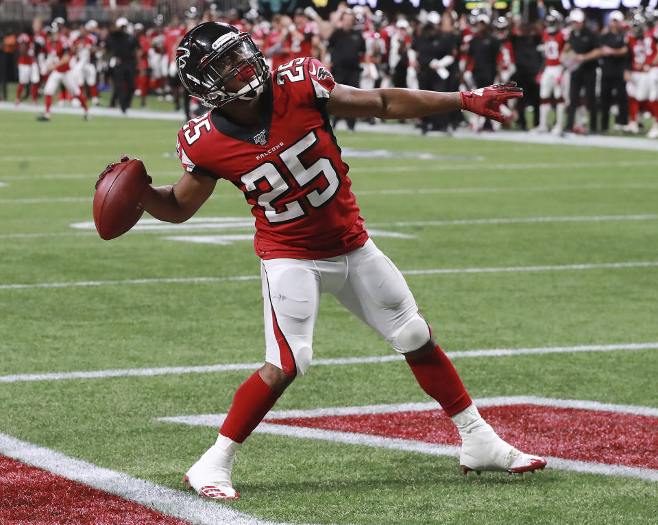 Atlanta Falcons running back Ito Smith throws the ball to the fans after scoring against the New York Jets during the first half of an NFL football preseason game Thursday, Aug. 15, 2019, in Atlanta. (Curtis Compton/Atlanta Journal Constitution via AP)