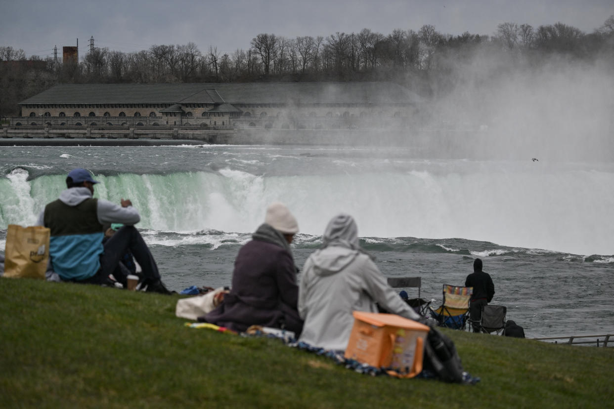 People are set up at Niagara Falls State Park ahead of a total solar eclipse across North America, in Niagara Falls, N.Y. 