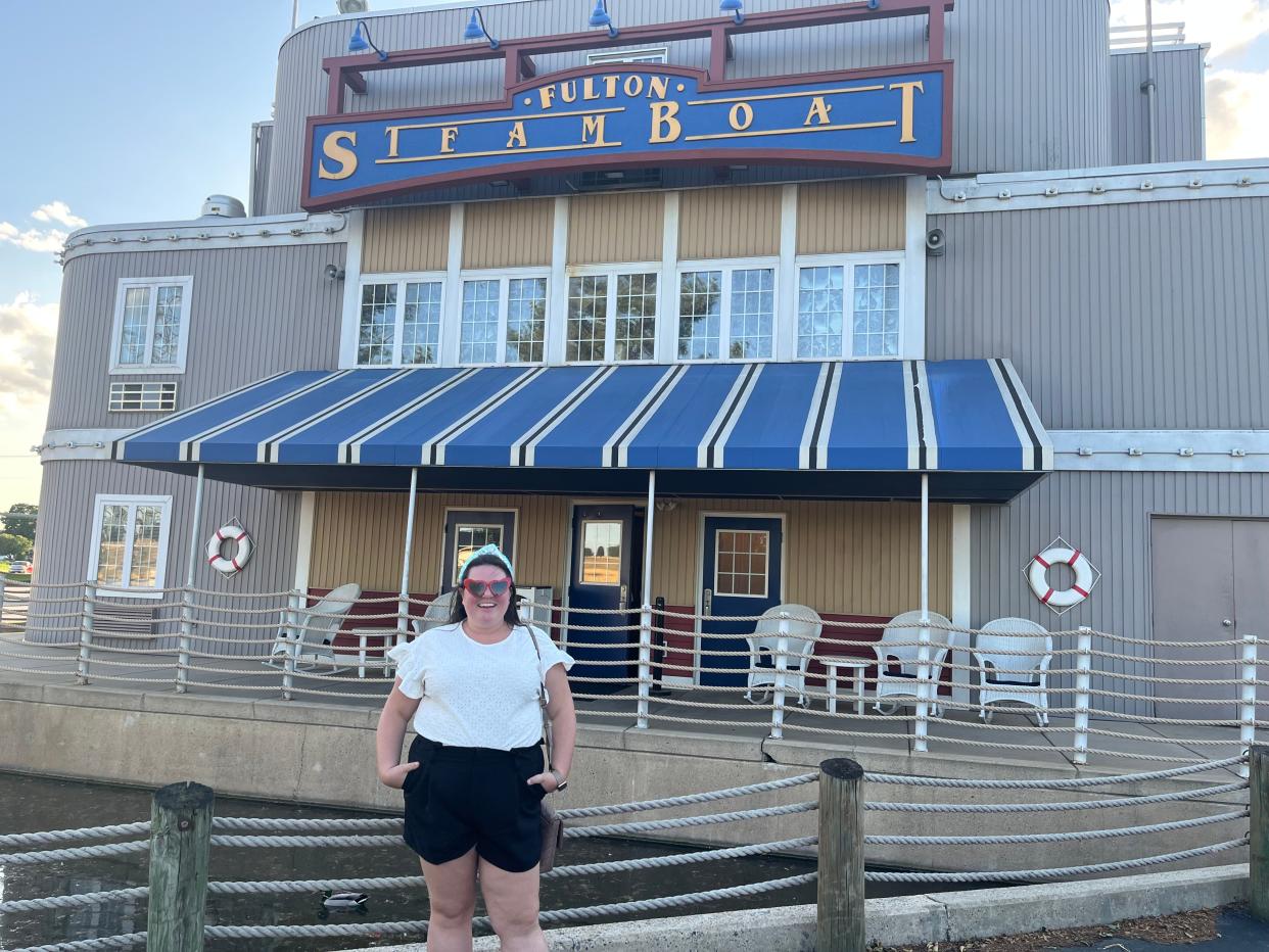 megan posing in front of the fulton steamboat inn