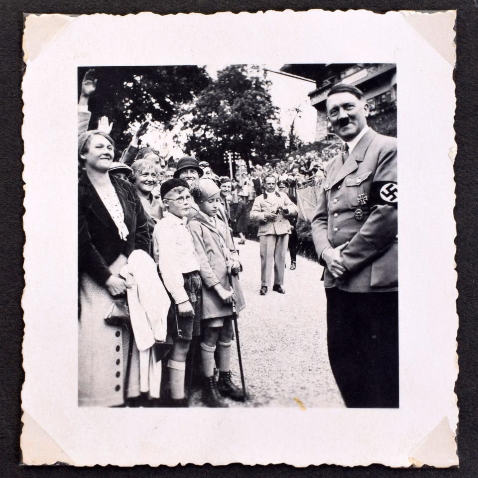 Never-before-seen photos of Adolf Hitler found in an album in mistress Eva Braun's bedroom