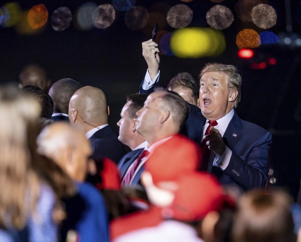 President Donald Trump arrives on Air Force One at Palm Beach International Airport in West Palm Beach, Fla., on Tuesday, Nov. 26, 2019. (Richard Graulich /Palm Beach Post via AP)