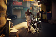 It's early morning, beautiful sunlight shining into a narrow street of Udaipur. A local Rajasthani man using his bike to carry fresh milk to sell on the street. (Photograph by Xuesong Liao, <a href="http://travel.nationalgeographic.com/travel/traveler-magazine/photo-contest/2012/" rel="nofollow noopener" target="_blank" data-ylk="slk:National Geographic Traveler Photo Contest;elm:context_link;itc:0;sec:content-canvas" class="link ">National Geographic Traveler Photo Contest</a>) <br> <br> <a href="http://travel.nationalgeographic.com/travel/traveler-magazine/photo-contest/2012/entries/recent-entries/" rel="nofollow noopener" target="_blank" data-ylk="slk:Click here;elm:context_link;itc:0;sec:content-canvas" class="link ">Click here</a> to see all contest entries <br> <a href="http://travel.nationalgeographic.com/travel/traveler-magazine/photo-contest/2012/entries/wallpaper/outdoor-scenes-week-7/" rel="nofollow noopener" target="_blank" data-ylk="slk:Click here;elm:context_link;itc:0;sec:content-canvas" class="link ">Click here</a> for contest wallpapers