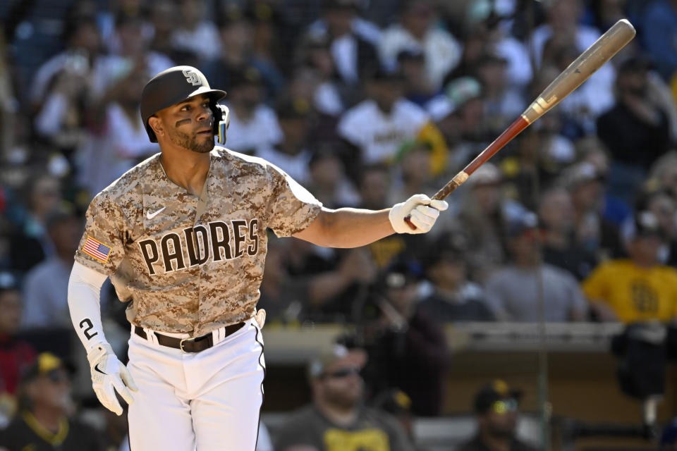 San Diego Padres' Xander Bogaerts follows through to watch his RBI double to score Manny Machado against the Los Angeles Dodgersduring the first inning of a baseball game in San Diego, Sunday, May 7, 2023. (AP Photo/Alex Gallardo)