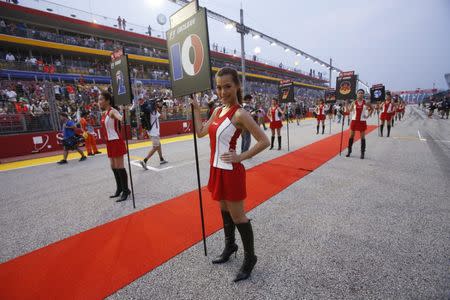 FILE PHOTO - Formula One grid girls are seen before the start of the Singapore F1 Grand Prix at the Marina Bay street circuit in Singapore September 23, 2012. REUTERS/Edgar Su