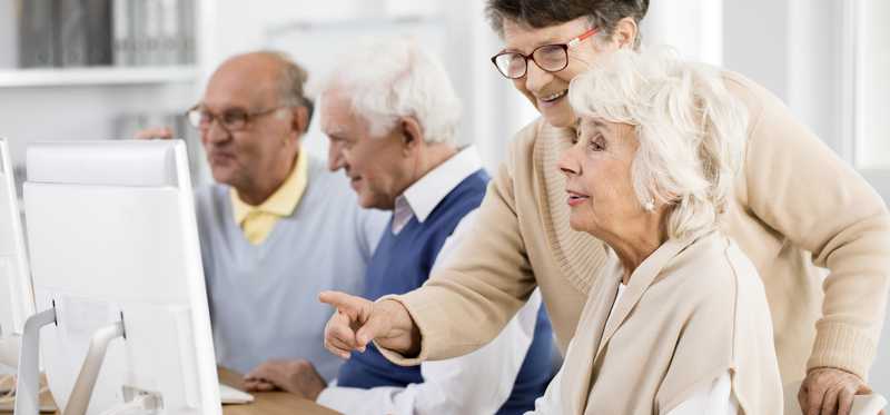 Senior citizens using computers.