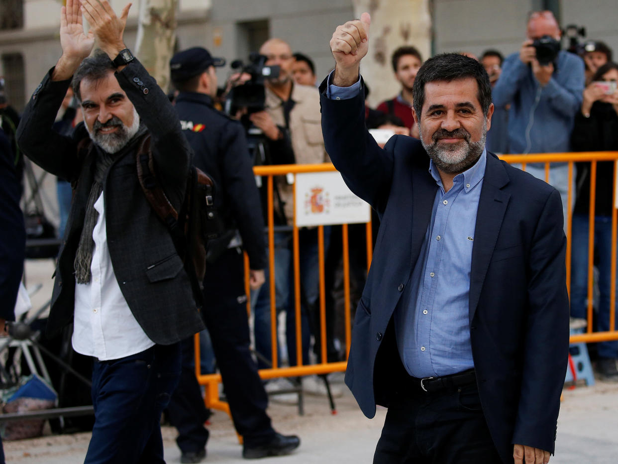 Jordi Cuixart (L), leader of Omnium Cultural, and Jordi Sanchez of the Catalan National Assembly, arrive at the High Court in Madrid on 16 October: REUTERS