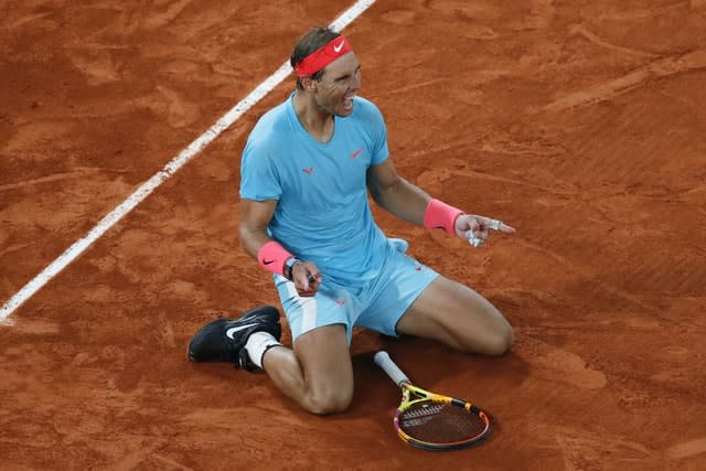 Rafael Nadal collapses to the ground after winning his 13th French Open 